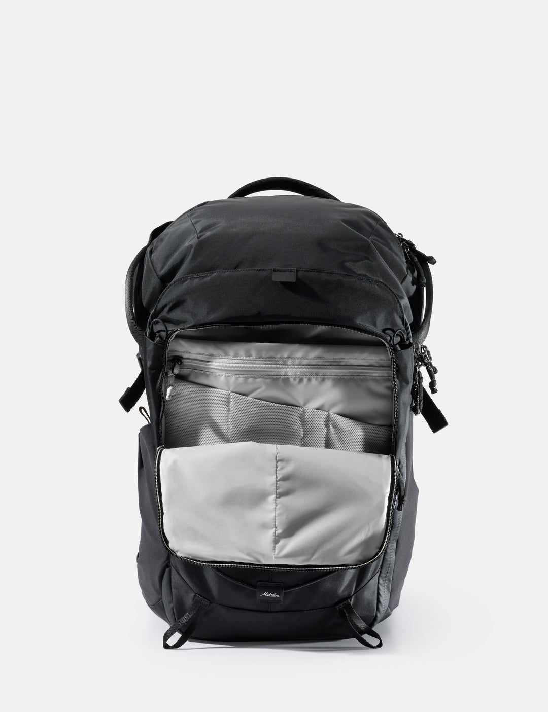 Matador 24L Adventure Pack in Black - black backpack with a gray compartment on a white background