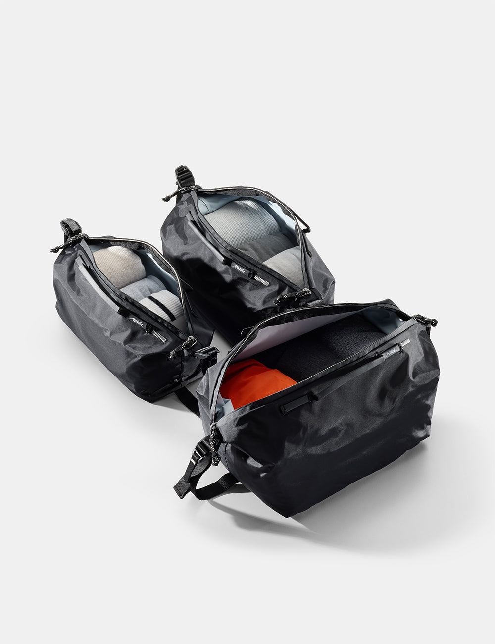 Matador Gear Cube Set (V2) in Black - black gear cubes with open compartments on a light gray background