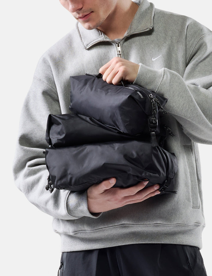 Matador Gear Cube Set (V2) in Black - person holding black gear cubes against a light gray background