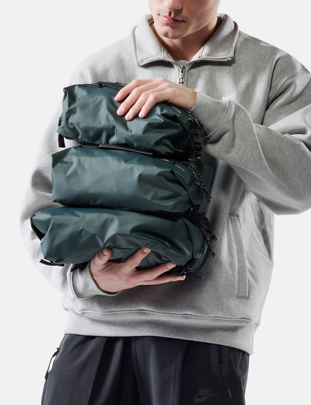 Matador Gear Cube Set (V2) in Juniper - person holding a green compression bag against a white background
