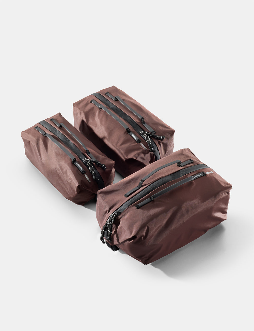 Matador Gear Cube Set (V2) in Garnet - three garnet gear cubes with zippers on a light gray background