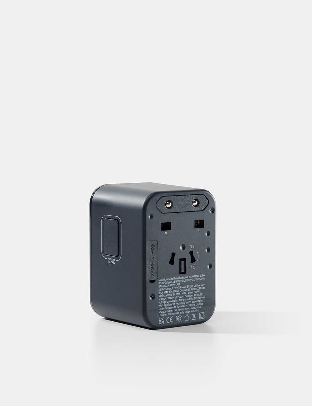 Matador Global Travel Adapter in Black - black travel adapter on a white background