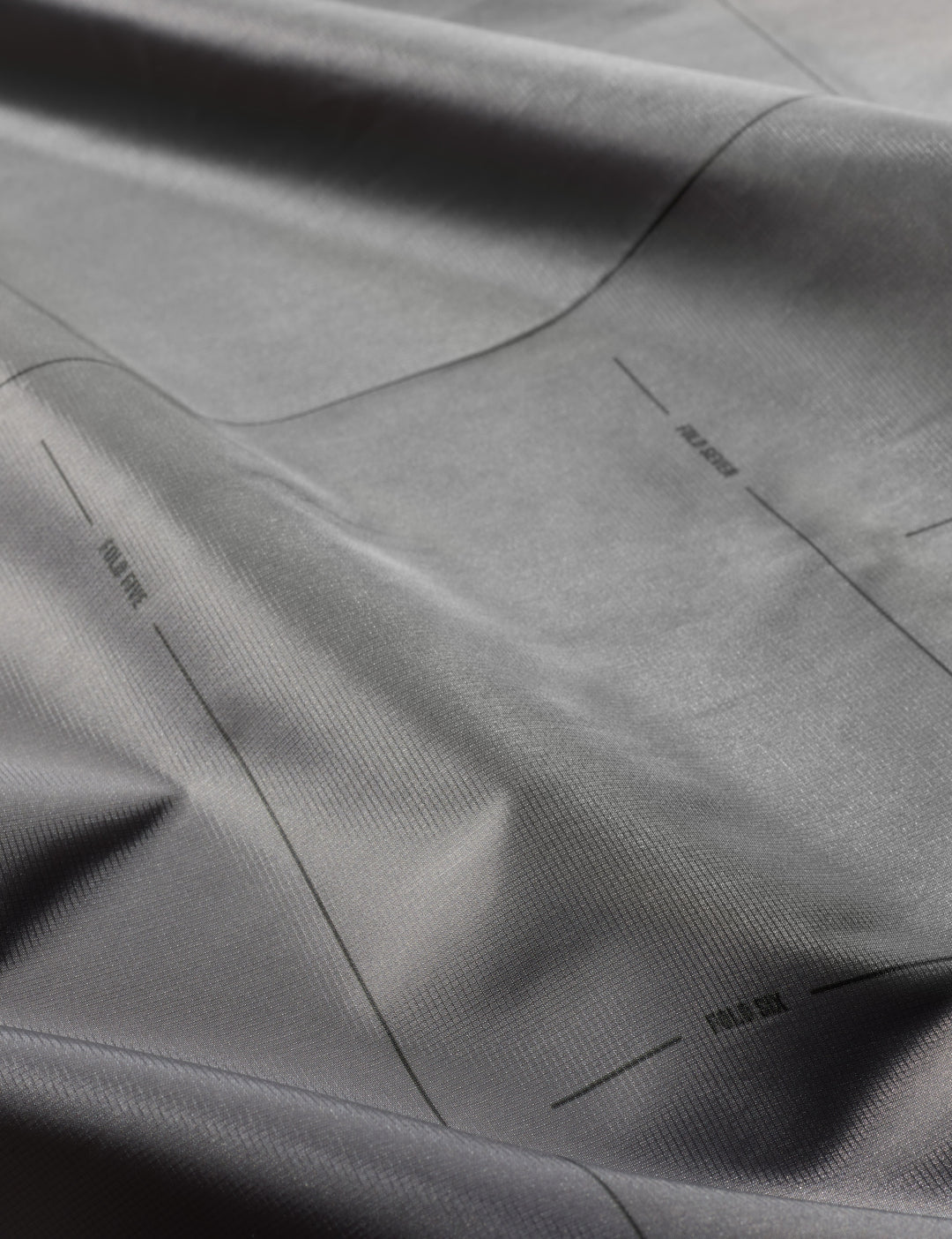 Matador Pocket Blanket™ 4.0 - 160 x 110cm in Blue - close-up of gray fabric with subtle texture