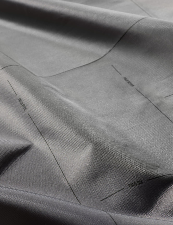 Matador Pocket Blanket™ 4.0 - 160 x 110cm in Ghost Grey - close-up of gray fabric with subtle texture