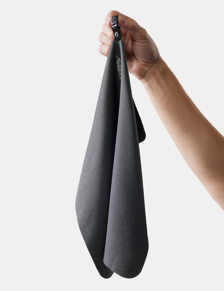 Matador NanoDry Towel - Small 39 x 39cm in Black Granite - hand holding small nanodry towel on white background