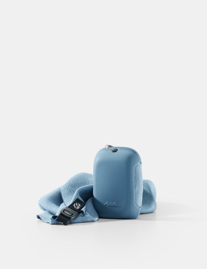 Matador NanoDry Towel - Small 39 x 39cm in Blue - slate nanodry towel and silicone case on white backgorund