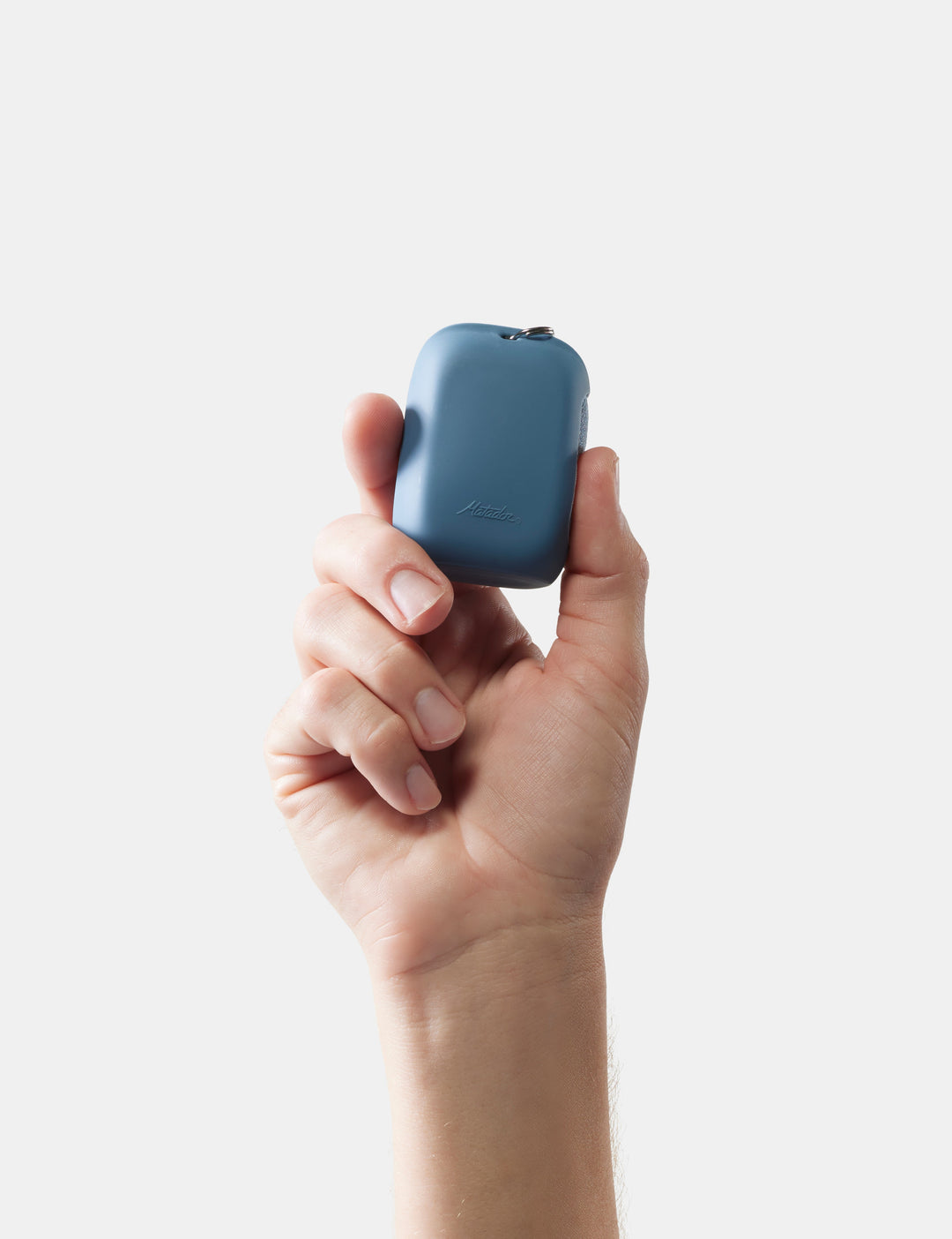 Matador NanoDry Towel - Small 39 x 39cm in Blue - hand holding slate nanodry case against a white background