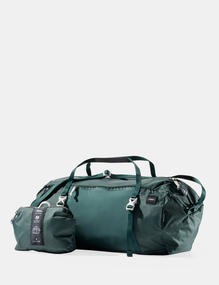 Matador 30L Packable Duffel in Juniper - green travel bag with smaller pouch on a light gray background