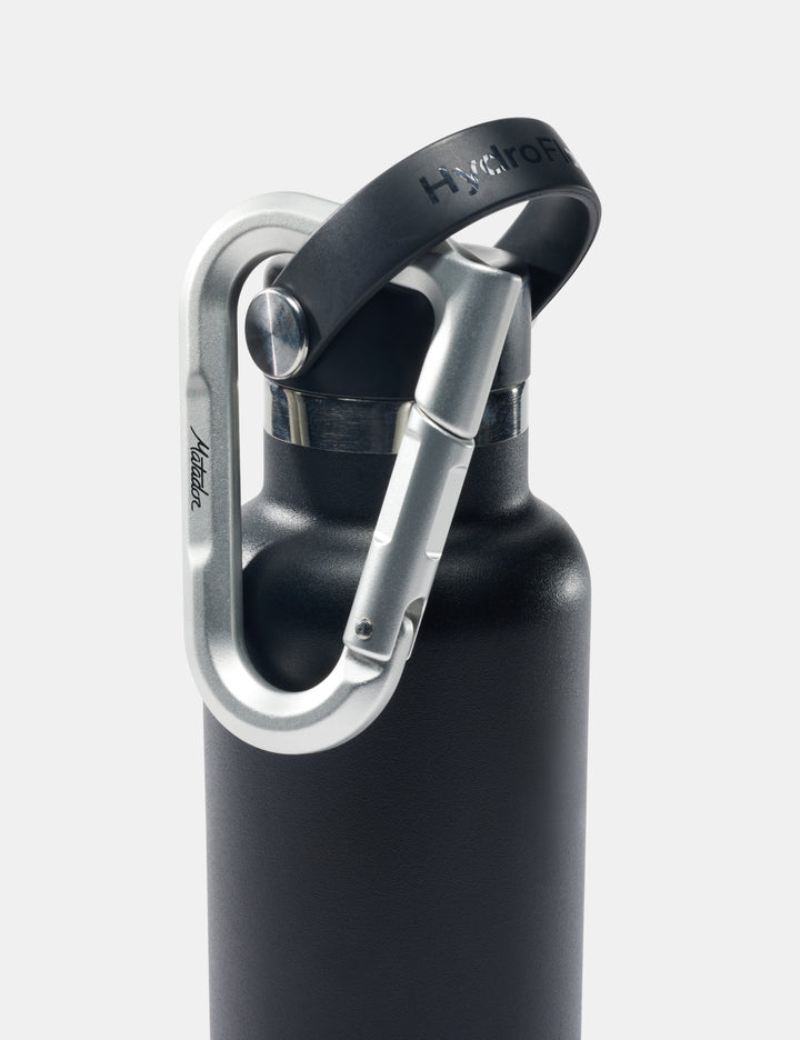 Matador BetaLock in Gold - black water bottle with silver carabiner on a white background
