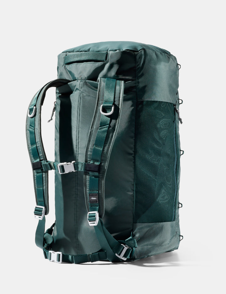 Matador 45L SEG Hybrid Travel Pack in Juniper - green backpack with multiple straps on a white background