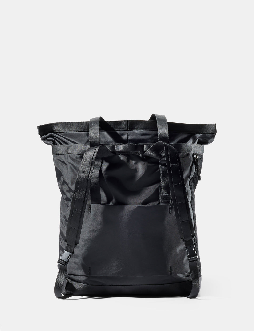 Matador 24L Tote Pack in Black - black tote pack on a light gray background