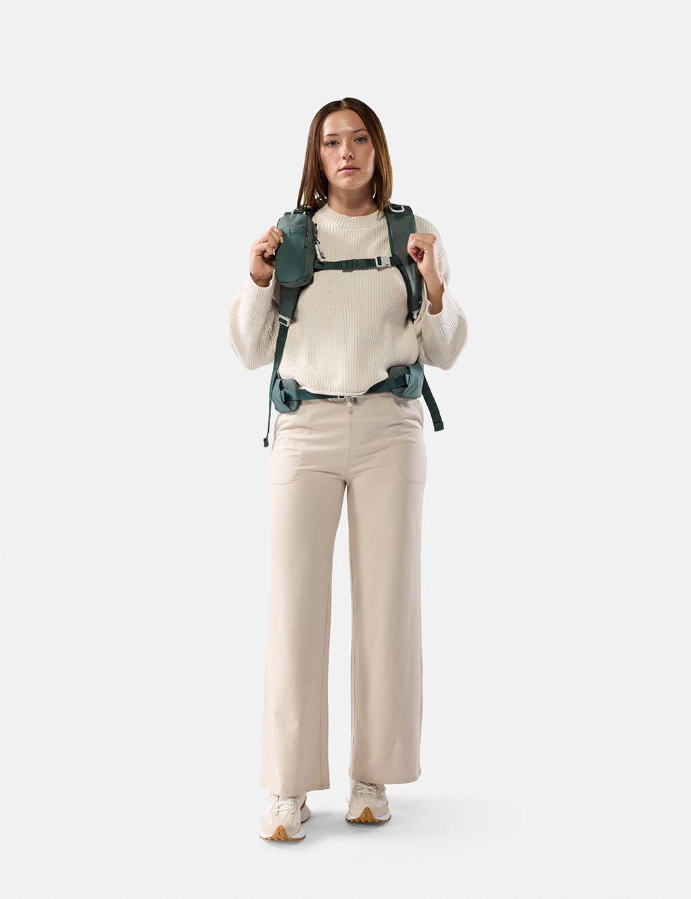 Matador Speed Stash (V2) in Juniper - woman wearing a green backpack on a white background