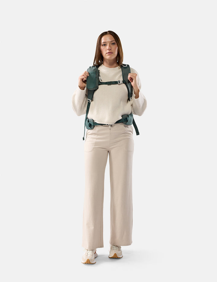 Matador Speed Stash (V2) in Juniper - woman wearing a green backpack on a white background