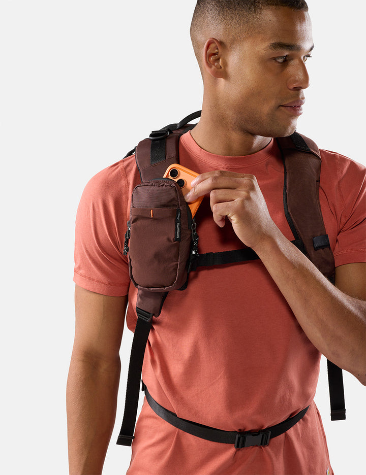 Matador Speed Stash (V2) in Garnet - man wearing a garnet backpack with a white background