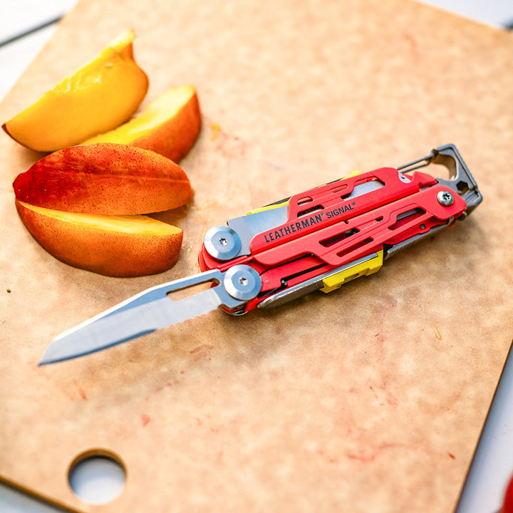 Leatherman Signal - slicing fruit on a cutting board, Guava - Nitecore Singapore